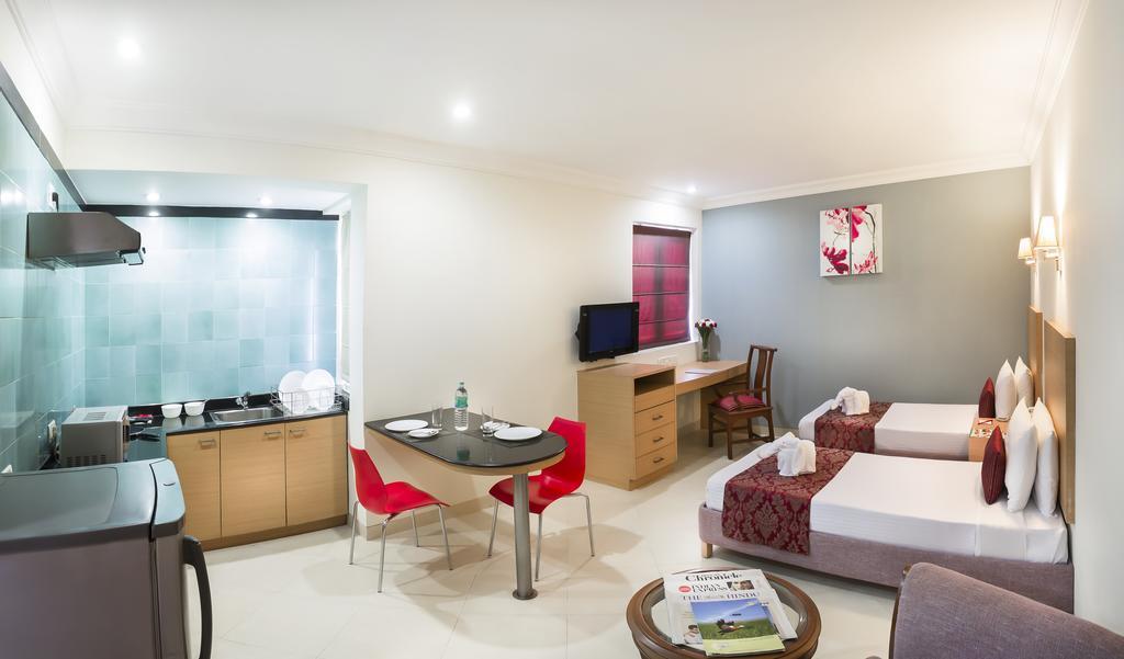 The Lotus Hotel, Burkit Road Apartamento